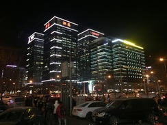 Buildings in the Wudaokuo neighborhood light up.